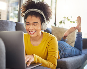 Image showing Laptop, headphones and woman relax on sofa for e learning, online education and audio translation or website service. Happy student or african person on couch, audio technology and computer for home