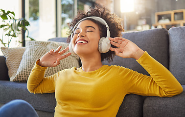 Image showing Headphones, music and happy woman with mental health, wellness dance or youth audio streaming service at home. Relax, floor and dancing of young african person with audio electronics or technology