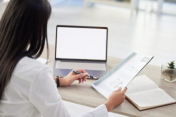 Image showing Sales report, woman writing and blank screen at computer in a office with reading and data. Information, professional employee and female person with business document, notebook and desktop pc mockup