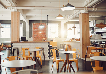 Image showing Empty, interior design of modern restaurant and open space with a lens flare during the day. Decoration, lights and luxury furniture for fine dining and set up of cafe or coffee shop in the city