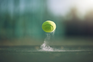 Image showing Sports, tennis and a ball bouncing on a court outdoor during a game, competition or training with chalk. Fitness, exercise and club with still life sport equipment outside for a workout or match