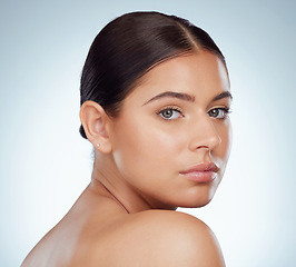 Image showing Face, skincare and beauty of serious woman in studio isolated on a white background. Portrait, natural and female model in makeup, cosmetics or facial treatment for skin health, aesthetic or wellness