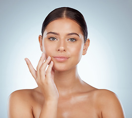 Image showing Face, serious skincare and beauty of woman in studio isolated on a white background. Portrait, natural and female model in makeup, cosmetics or facial treatment for skin health, aesthetic or wellness