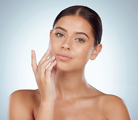 Image showing Face, skincare and beauty of woman in studio isolated on a white background. Portrait, natural and serious female model in makeup, cosmetics or facial treatment for skin health, aesthetic or wellness