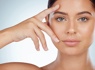 Image showing Face, skincare and beauty of woman in studio isolated on a white background. Portrait, natural and serious female model in makeup, cosmetics or facial treatment for skin health, aesthetic or wellness