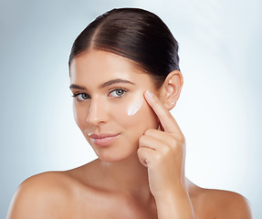 Image showing Face, skincare and beauty of woman with cream in studio isolated on a white background. Portrait, dermatology lotion and female model apply cosmetics, sunscreen or moisturizer product for skin health