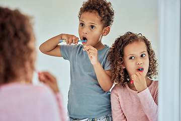 Image showing Brushing teeth, mirror and dental with children in bathroom for morning, smile and cleaning. Oral hygiene, health and toothbrush with brother and sister in family home for wake up, mouth and results