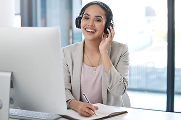 Image showing Headphones, happy and portrait of business woman with smile listening to radio, song and audio in office. Corporate workplace, music and face of female worker writing notes, planning and schedule