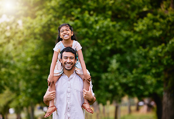 Image showing Piggyback, portrait and father with child in a park happy, playing and having fun together. Shoulder, games and face of girl with parent in forest, relax and smile in nature with love on the weekend