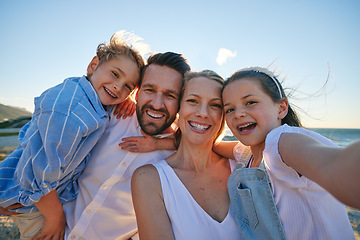 Image showing Parents, kids and beach selfie with smile, hug or care in summer sunshine on outdoor holiday. Father, mother and young children with photography, profile picture or together with bond on social media