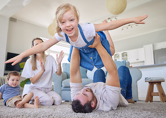 Image showing Happy family, parents and children on carpet in living room playing, bonding and airplane game time. Home, love and playful energy, mom and dad with kids on floor, laughing and relax with happiness.