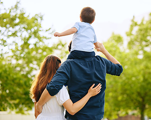 Image showing Dad, son and girl in park with back, hug and sitting on shoulders with care, love and walk together in summer. Man, young children and embrace with piggyback, trees and forrest with bond on holiday