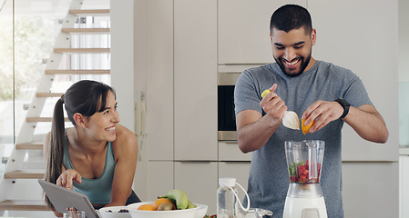 Image showing Smoothie, couple and health recipe with fruit, healthy food and smile at home. Nutrition, breakfast and tablet of a woman and man together with juice blender and happiness from nutritionist cooking