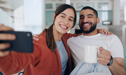 Image showing Home, selfie and couple smile on sofa for social media post, online vlog and internet with coffee. Dating, morning and happy man and woman take picture for update, bonding and relax in living room