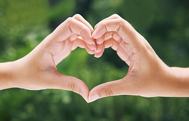 Image showing Hands, heart and emoji with eco friendly friends outdoor together in summer for love or solidarity. Social media, icon and hand gesture with people outside in nature for sustainability or bonding