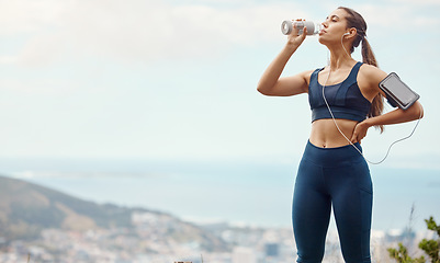 Image showing Fitness, relax, woman with drinking water and hiking in nature mockup for health and wellness during exercise. Music, bottle and fit girl on hike in park with phone, earphones and radio or podcast.