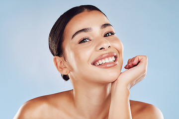Image showing Portrait, skincare and woman with cosmetics, smile and dermatology against blue studio background. Face, female person or model with salon treatment, luxury and grooming with foundation and aesthetic