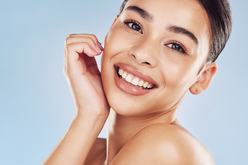 Image showing Portrait, skincare and woman with dermatology, natural beauty and luxury against a blue studio background. Face, female person and model with spa treatment, cosmetics and makeup with shine and glow