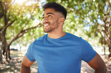 Image showing Fitness, smile and man or runner outdoor for exercise, training or running at a park. Happy Indian male athlete in nature or forest for a workout, run and break while thinking of goals or performance