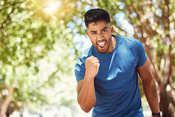 Image showing Running, portrait and a man celebrate outdoor for exercise, training or fitness goals. Excited Indian male athlete with a fist in nature for a workout, run and performance target, success or win