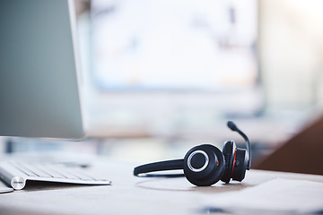 Image showing Call center, customer service and headset and computer on a desk in an empty office space. Crm, telemarketing and sales or technical support company with headphones for help desk consultation