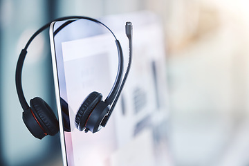 Image showing Headset, call center and computer for customer service in an empty office space. Crm, telemarketing and sales or technical support company with headphones and desktop pc for help desk consultation