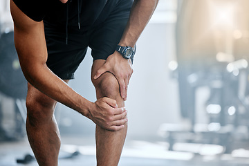 Image showing Fitness, gym and mockup, man with knee pain and medical emergency from workout injury at sports studio. Exercise, health and wellness, bodybuilder with hand on leg muscle ache for relief at training.