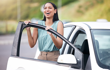 Image showing Excited, woman and outdoor with happiness driving her new car on a road for commute. Female person, happy purchase and first test drive with vehicle insurance and freedom on a street from work travel