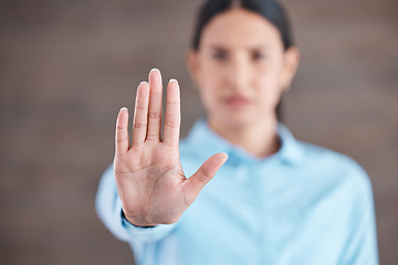 Image showing Stop, hand sign and woman with no gesture for sexual harassment and violence in workplace. Business professional, palm and female employee at company with stopping emoji for gender rights at job