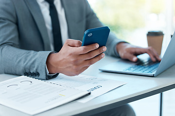 Image showing Hands of man with laptop, phone and desk at startup checking email, social media and search on internet at business. Online report, networking and businessman in office typing or reading on cellphone