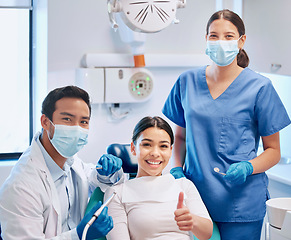 Image showing Portrait of dentist, thumbs up and patient in consultation for teeth whitening, service and dental care. Orthodontist, dentistry and woman with thank you sign for oral hygiene, healthcare or cleaning