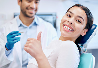 Image showing Happy, thumbs up and portrait of dentist and patient for teeth whitening, service and dental care. Healthcare, dentistry and hand sign of orthodontist and woman for oral hygiene, wellness or cleaning