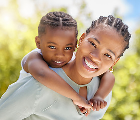 Image showing Piggyback, african mother and daughter in park portrait with smile, game or happiness with love in summer sunshine. Black woman, mom and girl with hug, happy and outdoor together in garden on holiday