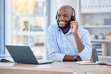 Image showing Happy black man, callcenter with phone call and contact us, communication with headset and CRM. Male consultant with smile, customer service or telemarketing with conversation and help desk employee