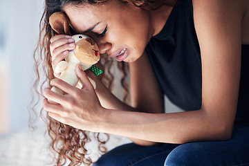 Image showing Depression, tears and woman with teddy bear in home for grief, miscarriage or mourning death of kid. Sad mother, crying and person with pain, anxiety or trauma problem, stress or frustrated in house