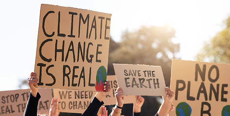 Image showing Protest, climate change and poster with a group of people outdoor at a rally or march for conservation. Global warming, freedom and environment with a crowd walking together during a community strike