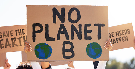 Image showing Protest, global warming and poster with a group of people outdoor at a rally or march for conservation. Climate change, freedom and environment with a crowd walking together during a community strike