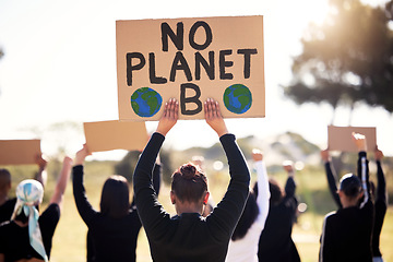 Image showing Protest, climate change and sign with a group of people outdoor at a rally or march for conservation. Global warming, poster and environment with a crowd walking together during a community strike