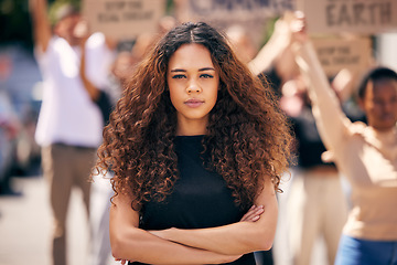 Image showing Woman, arms crossed and protest crowd in street for planet, climate change or sustainable future. Girl, leadership portrait or rally for earth, sustainability or justice for environment in metro road