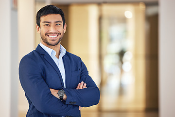 Image showing Confident, portrait and a businessman with arms crossed for corporate company, job and professional career. Happy, suit and a young Asian employee with a smile, pride and happiness at the office
