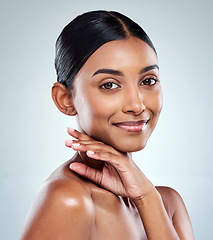 Image showing Smile, beauty and Indian woman or model with skincare cosmetic isolated in a studio white background. Clean, natural and portrait of female person hand on her face happy for self love or care