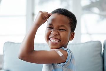 Image showing African boy kid, vaccine and portrait with smile, medicine and flex muscle for wellness in hospital. Male child, strong and excited with plaster for injection, healthcare and injection to stop virus