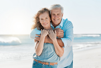 Image showing Senior, couple and portrait hug at the beach for happiness and bond in the outdoor. Mature, man and woman holding one another at the ocean with smile and love for vacation and travel in summer