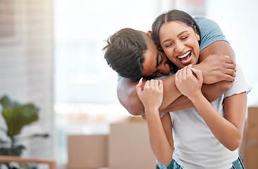 Image showing Hug, love and couple laugh in new home excited for property, apartment and real estate investment, Relationship, house and man and woman embrace, laughing and happy in living room on moving day