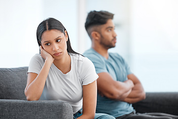 Image showing Couple, fight and woman feeling sad and depressed on living room sofa with relationship problem. Divorce talk, cheating anxiety and marriage crisis of young people on a lounge couch at home thinking