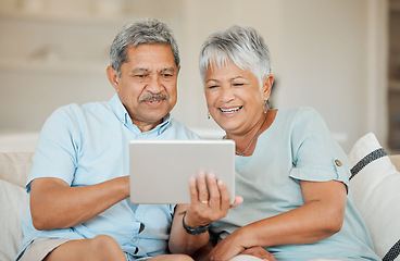 Image showing Technology, senior and couple with tablet happy on sofa in living room of their home. Connectivity or social networking, cheerful and smile with married people on couch streaming movie for retirement