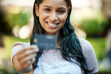 Image showing Portrait, woman and entrepreneur with smile, outdoor and banking with apron, shopping or budget. Portrait, female person or business owner with ecommerce, budget or credit card with discount and deal