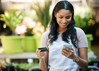 Image showing Credit card, phone and a woman with a payment at a nursery for stock, plants or shopping on the web. Ecommerce, pay and a happy business owner or customer buying a plant on sale on a mobile app