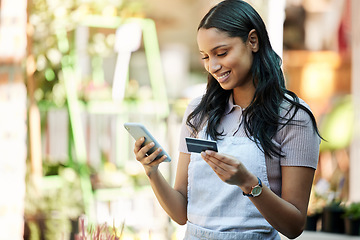 Image showing Woman, credit card and business owner with ecommerce, online shopping and digital payment. Outdoor, banking app and female employee with a smile with mobile connectivity on web for purchase at cafe