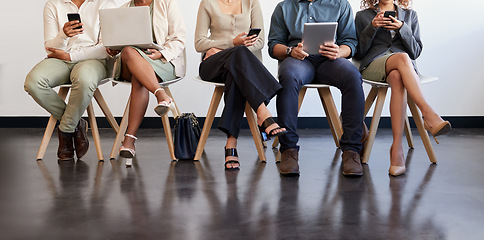 Image showing Technology, legs and people waiting for an interview in line at a human resources office as candidates for a vacancy. We are hiring, recruitment and opportunity with man and woman employees online